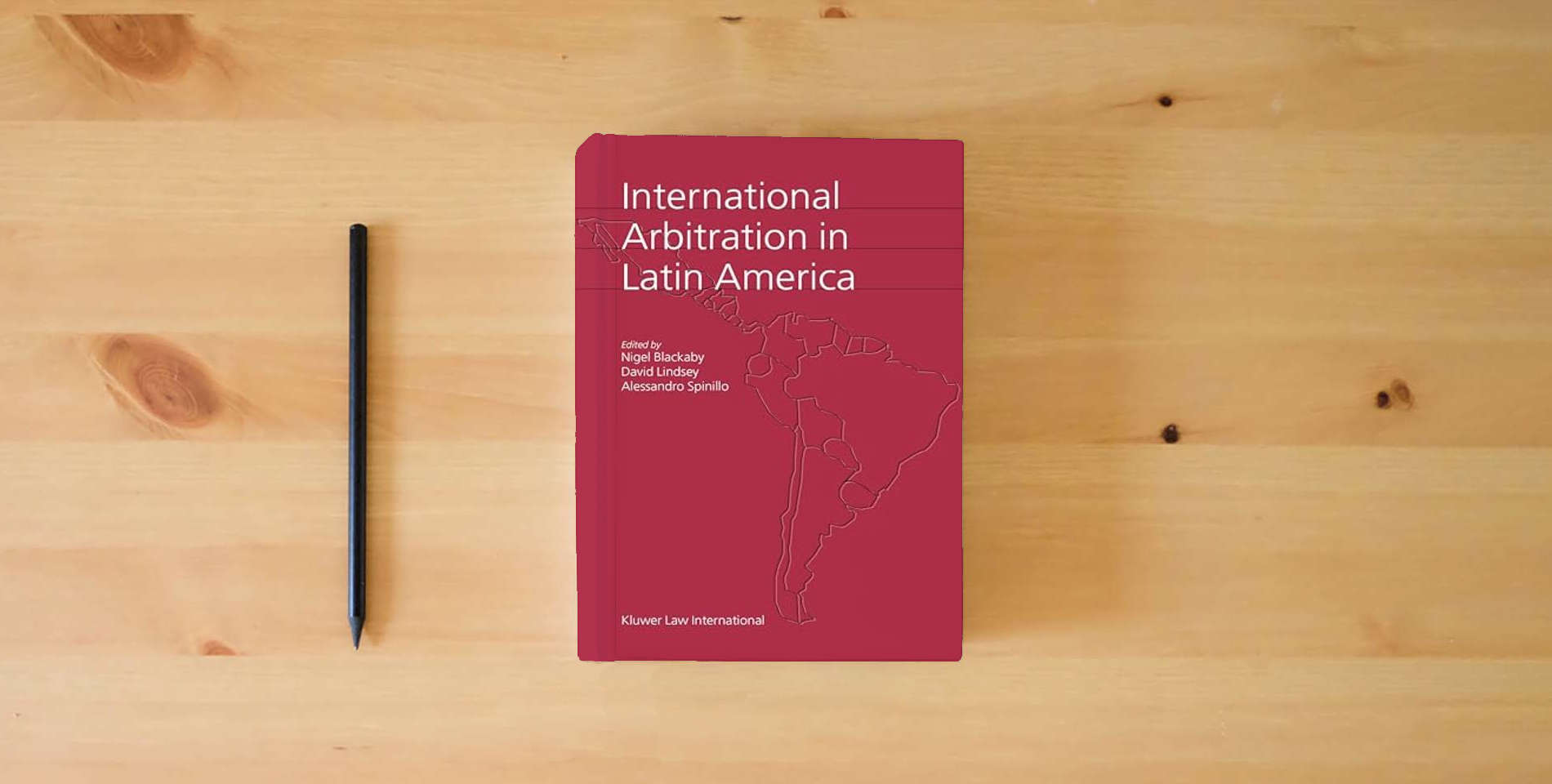 The book International Arbitration in Latin America is on the table