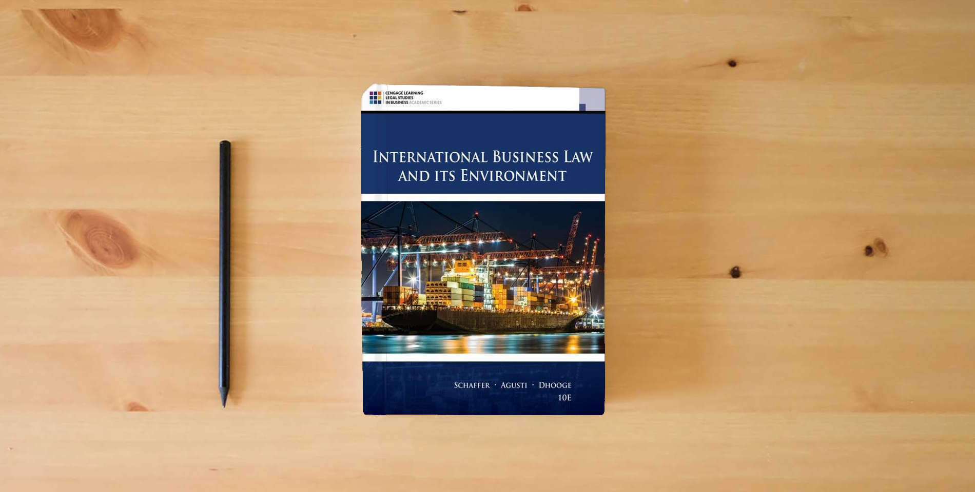 The book International Business Law and Its Environment is on the table