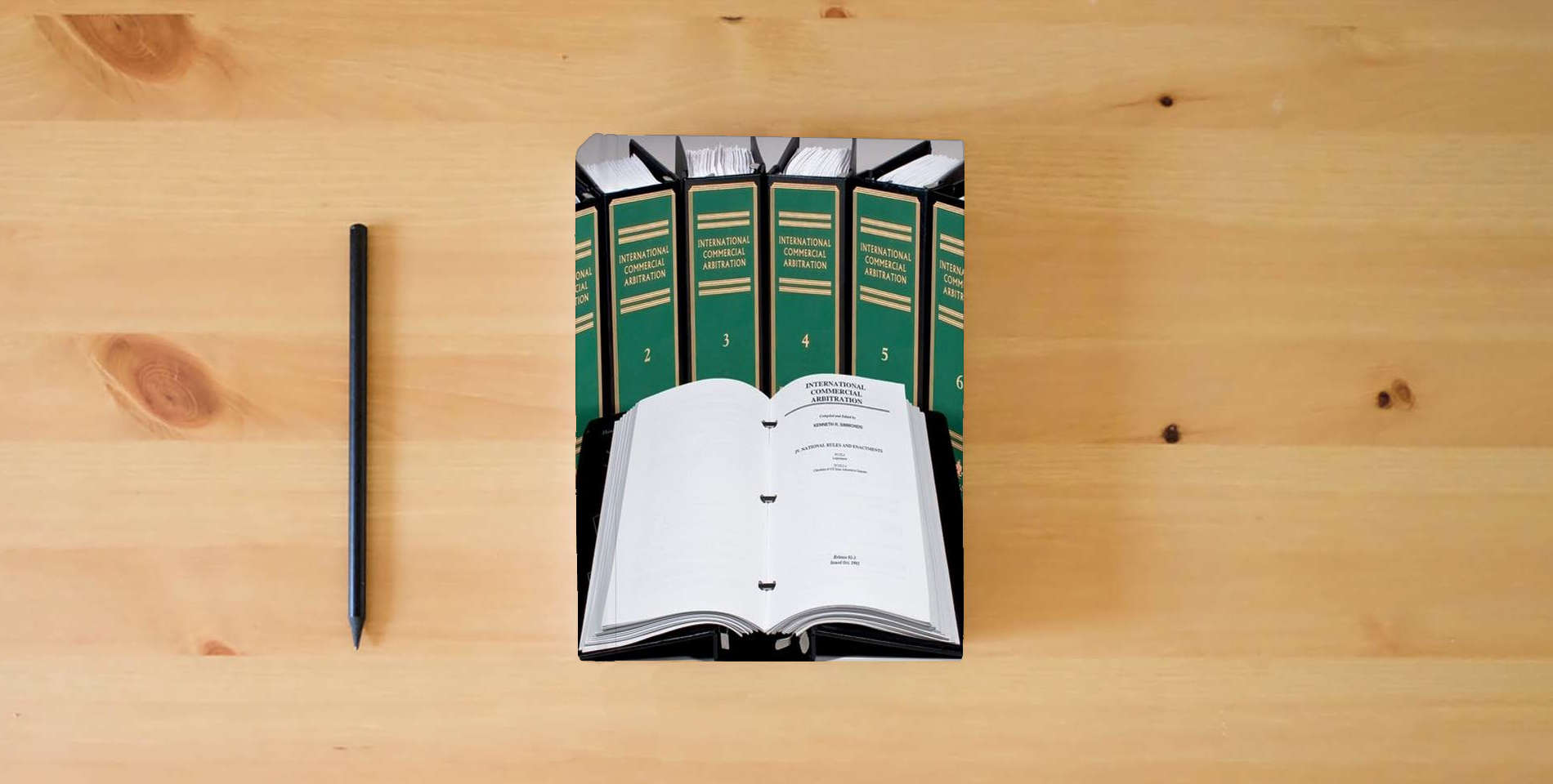 The book International Commercial Arbitration is on the table