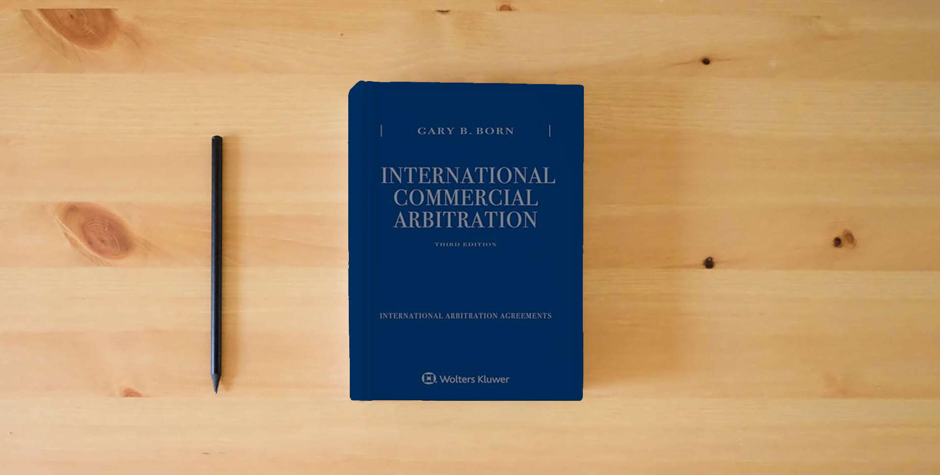 The book International Commercial Arbitration: Three Volume Set is on the table