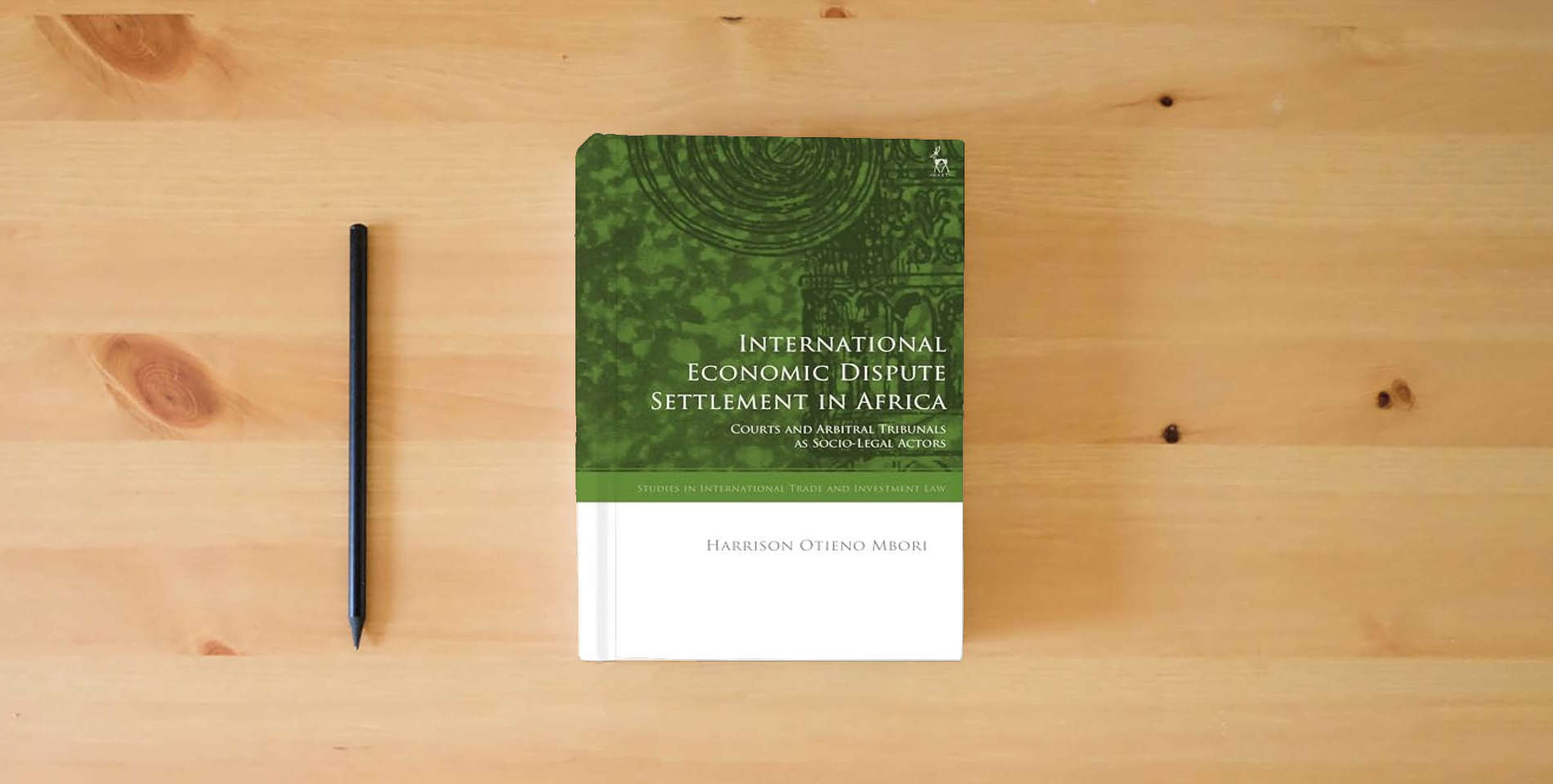 The book International Economic Dispute Settlement in Africa: Courts and Arbitral Tribunals as Socio-Legal Actors (Studies in International Trade and Investment Law) is on the table