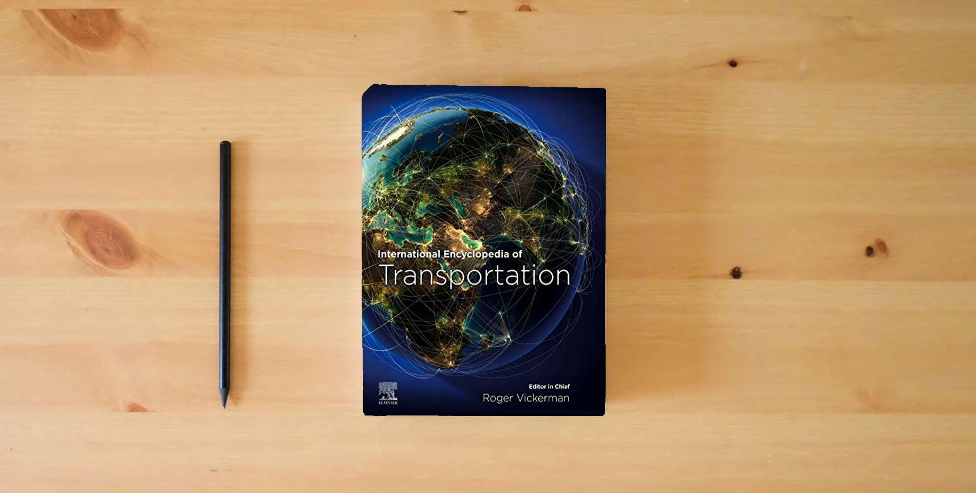 The book International Encyclopedia of Transportation is on the table