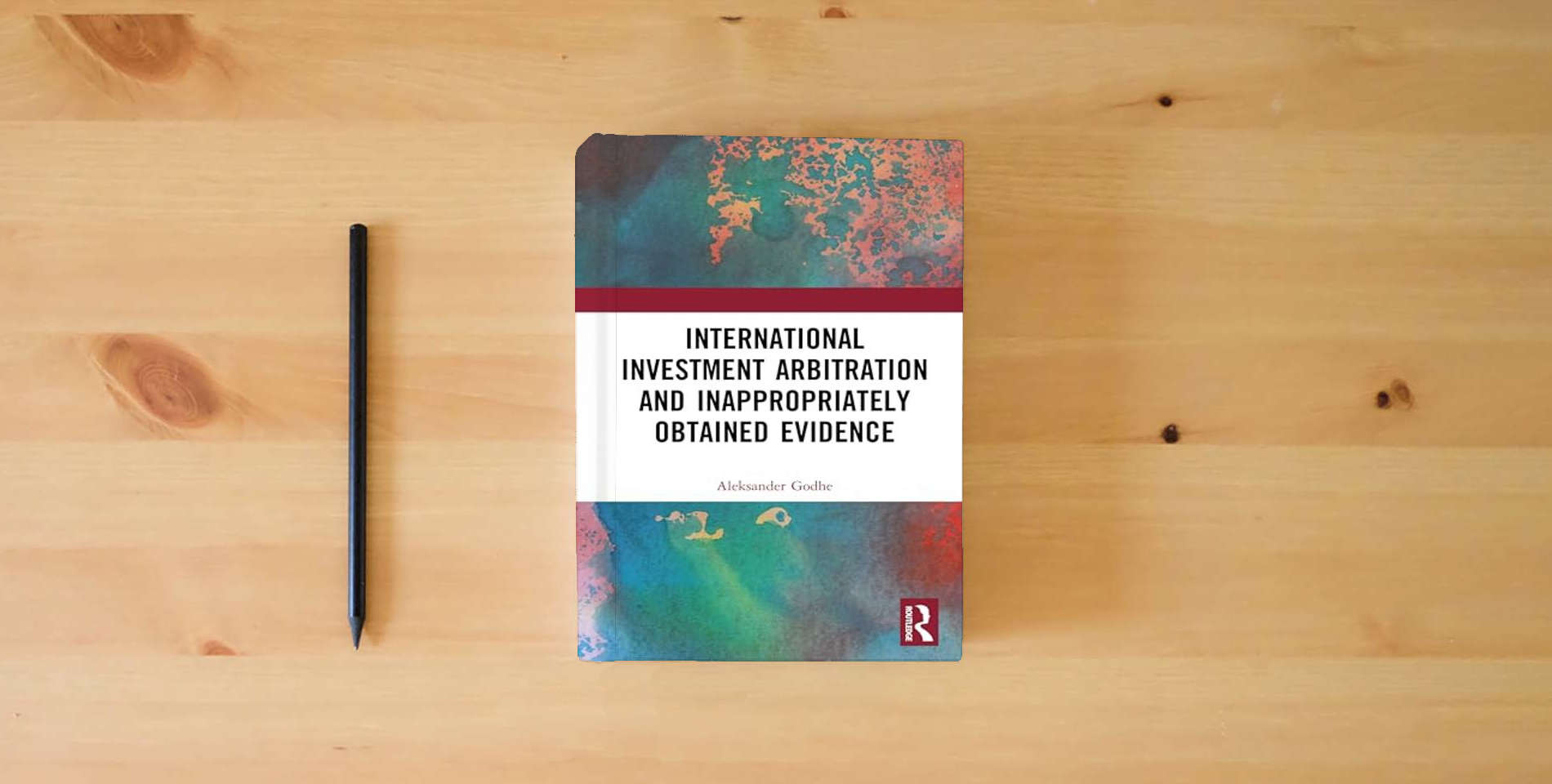 The book International Investment Arbitration and Inappropriately Obtained Evidence is on the table