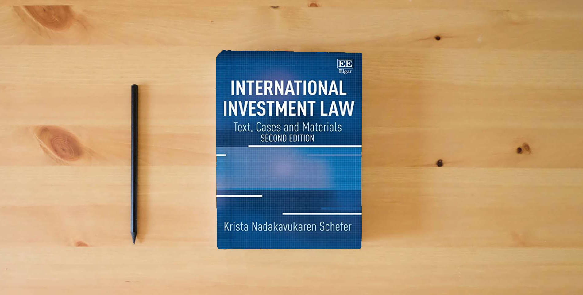 The book International Investment Law: Text, Cases and Materials: Second Edition is on the table