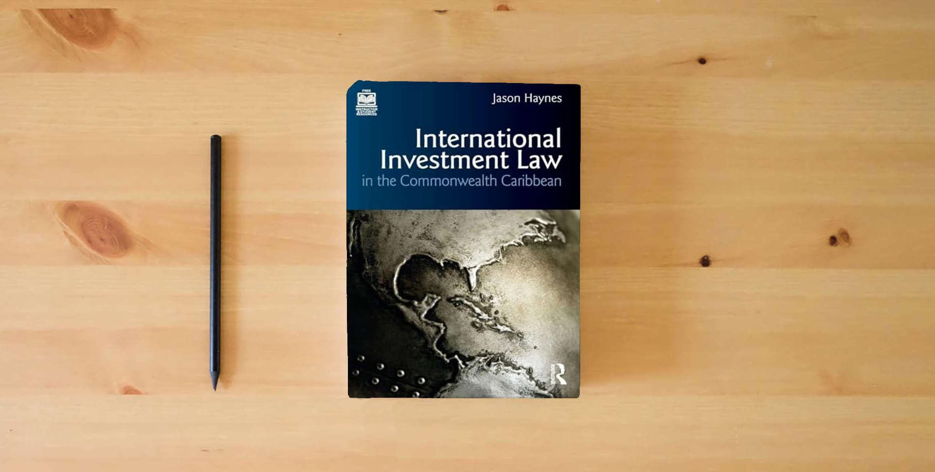 The book International Investment Law in the Commonwealth Caribbean is on the table