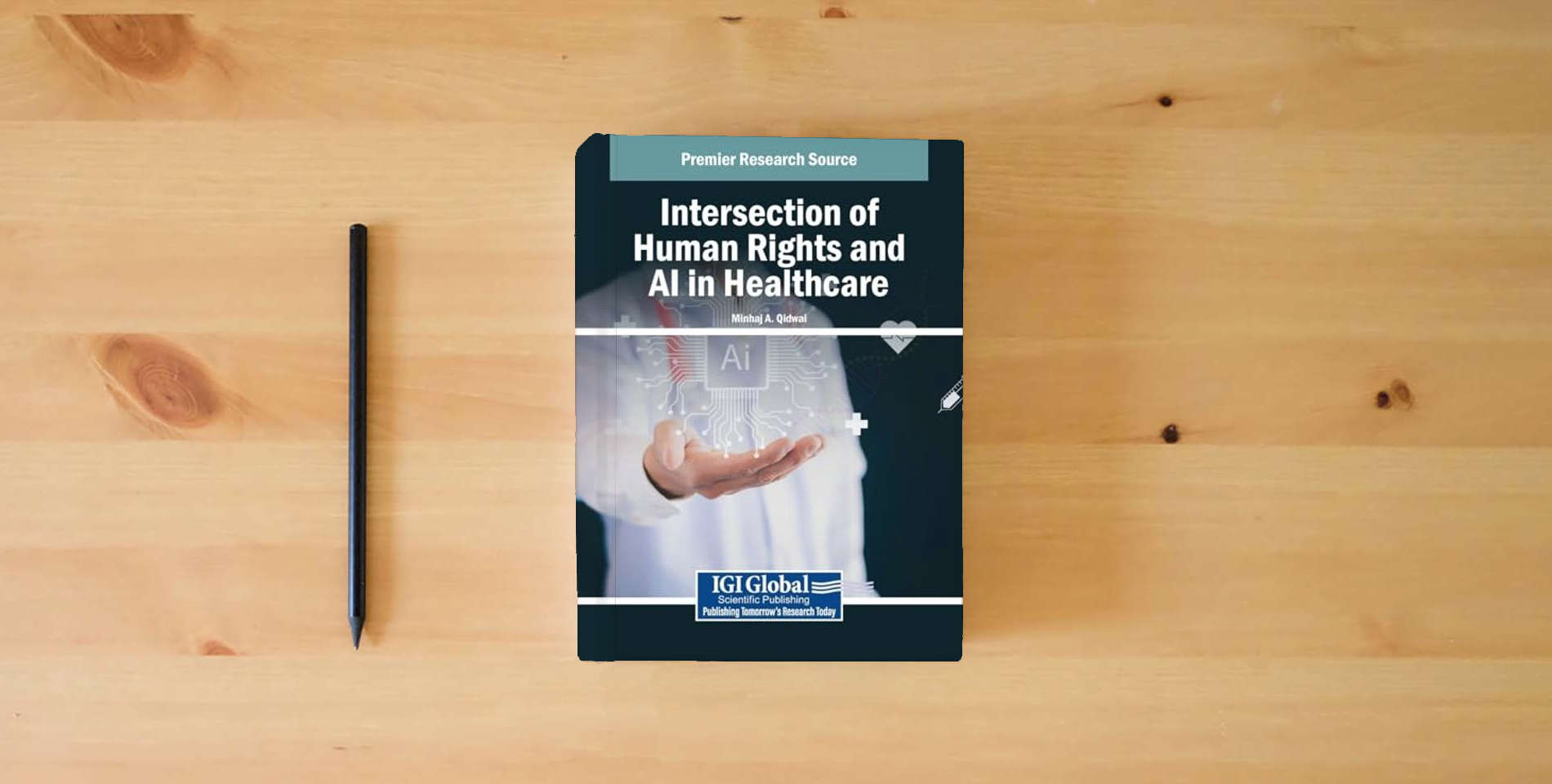 The book Intersection of Human Rights and AI in Healthcare is on the table