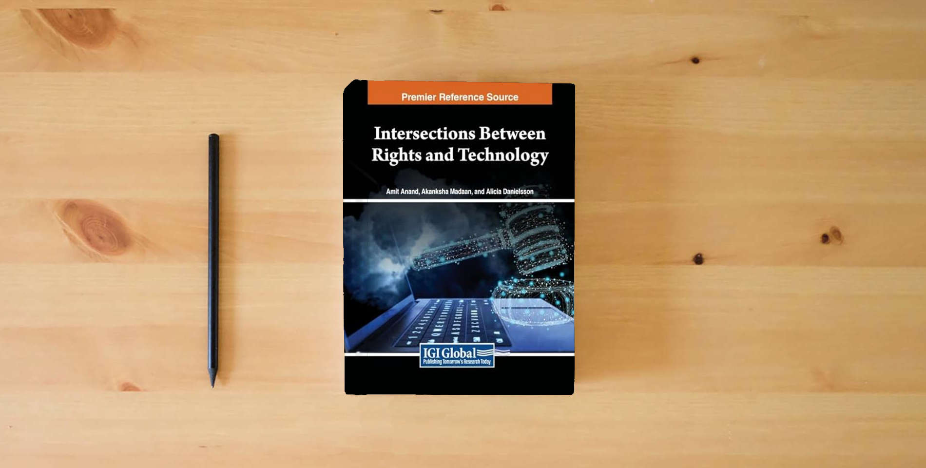 The book Intersections Between Rights and Technology is on the table