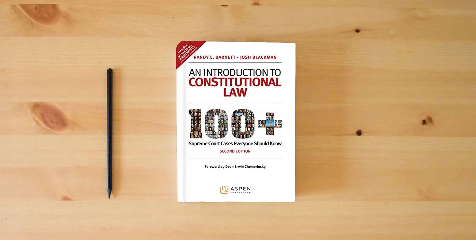 The book An Introduction to Constitutional Law: 100+ Supreme Court Cases Everyone Should Know is on the table