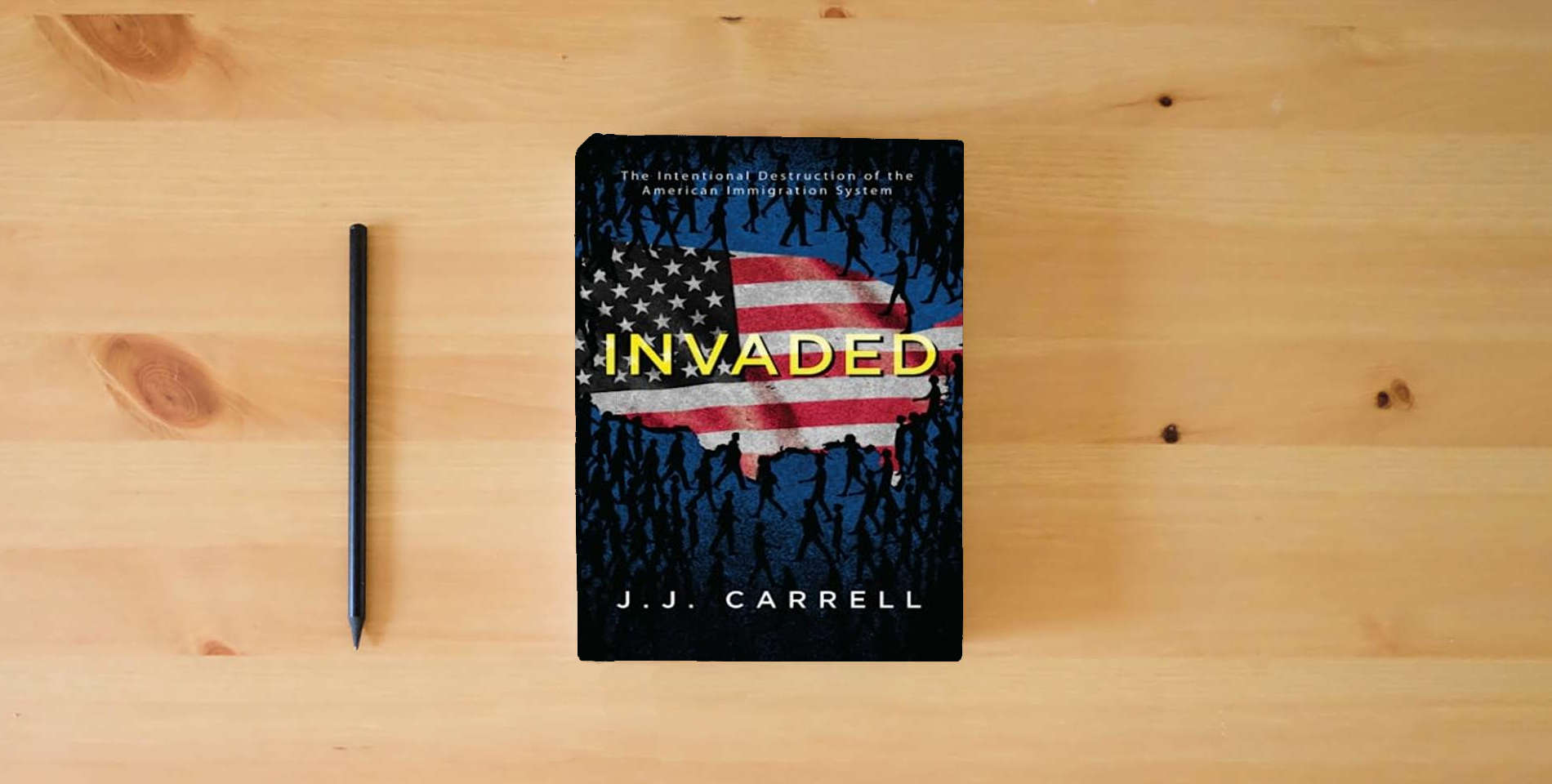 The book Invaded: The Intentional Destruction of the American Immigration System is on the table
