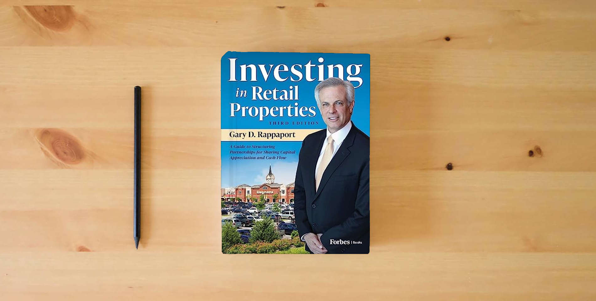The book Investing in Retail Properties, 3rd Edition: A Guide to Structuring Partnerships for Sharing Capital Appreciation and Cash Flow is on the table