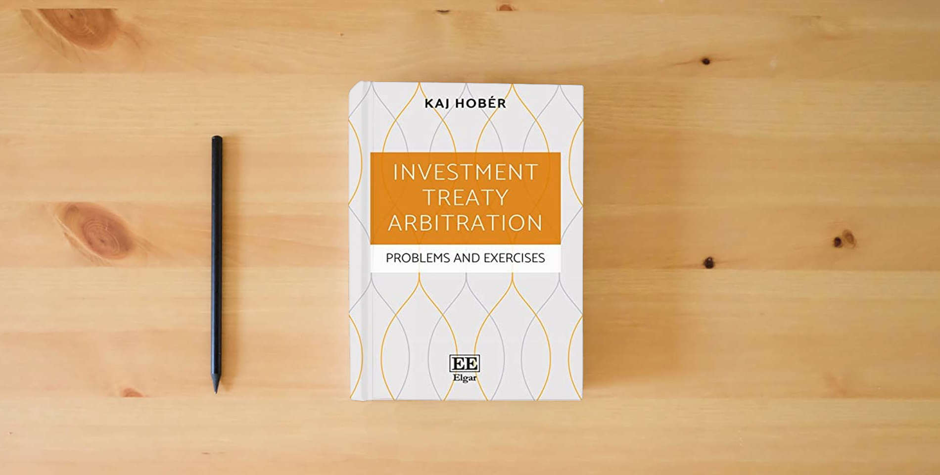 The book Investment Treaty Arbitration: Problems and Exercises is on the table