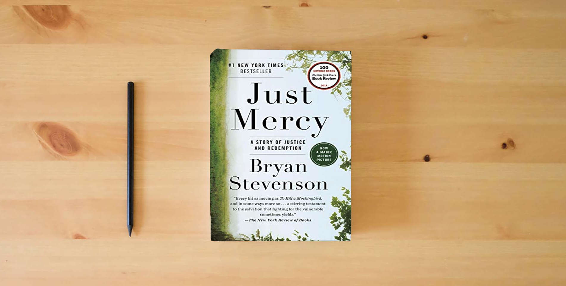 The book Just Mercy: A Story of Justice and Redemption is on the table