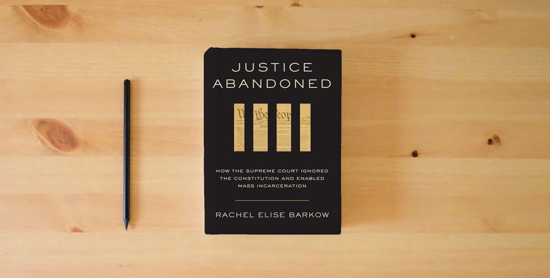 The book Justice Abandoned: How the Supreme Court Ignored the Constitution and Enabled Mass Incarceration is on the table