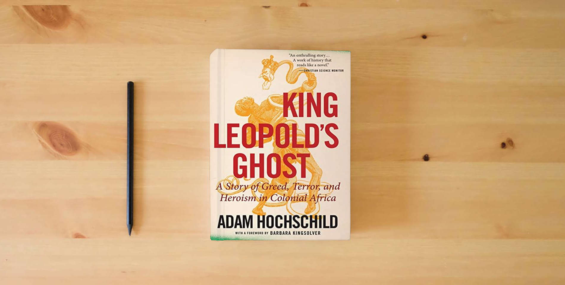 The book King Leopold's Ghost: A Story of Greed, Terror, and Heroism in Colonial Africa is on the table
