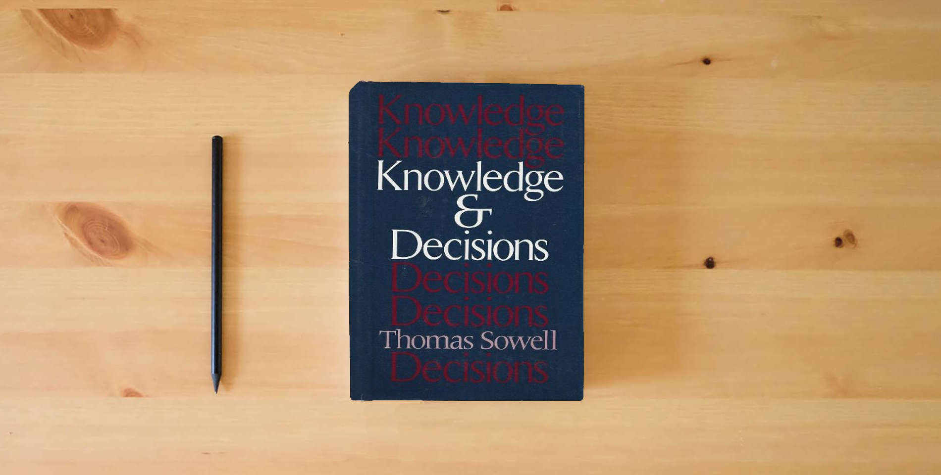 The book Knowledge & Decisions is on the table