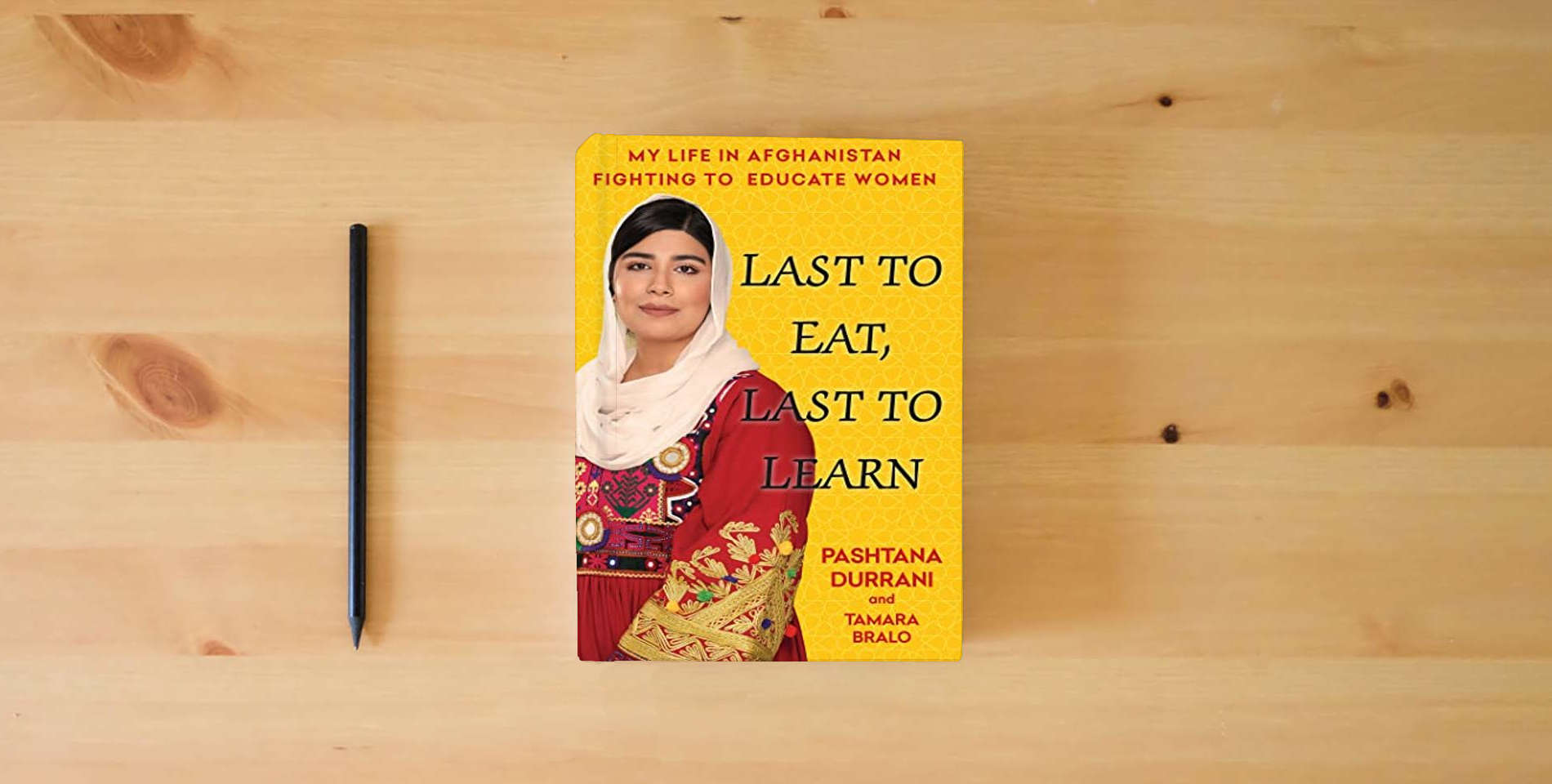 The book Last to Eat, Last to Learn: My Life in Afghanistan Fighting to Educate Women is on the table
