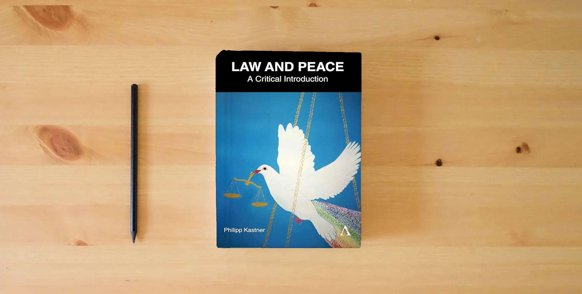 The book Law and Peace: A Critical Introduction (Anthem IGLP Rethinking Global Law and Policy Series, 1) is on the table