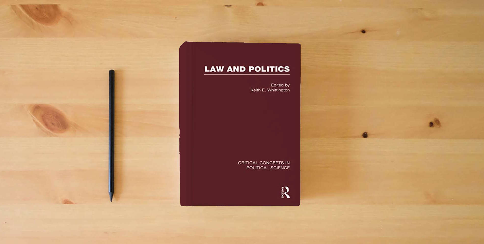 The book Law and Politics (Critical Concepts in Political Science) is on the table