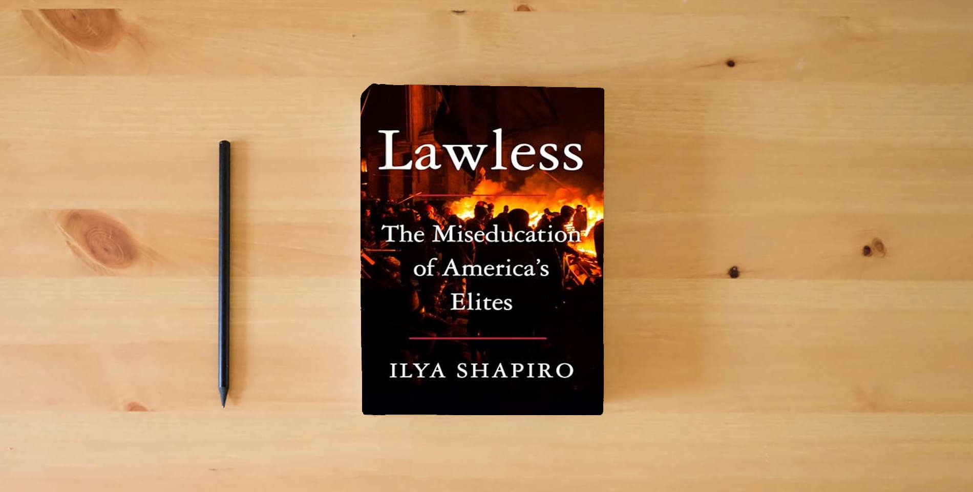 The book Lawless: The Miseducation of America's Elites is on the table