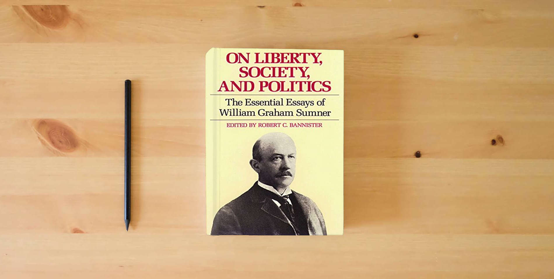 The book On Liberty, Society, and Politics is on the table