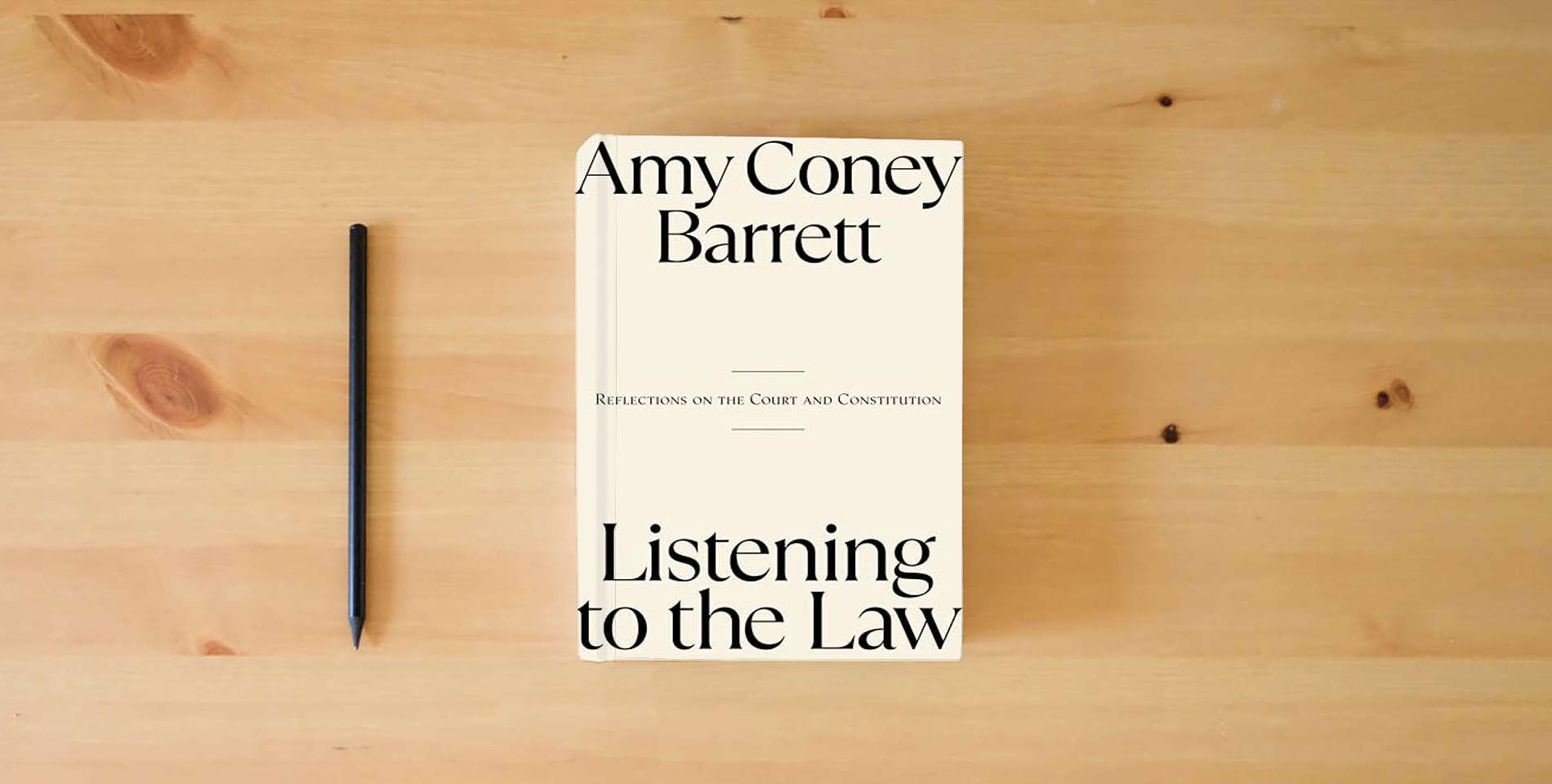 The book Listening to the Law: Reflections on the Court and Constitution is on the table