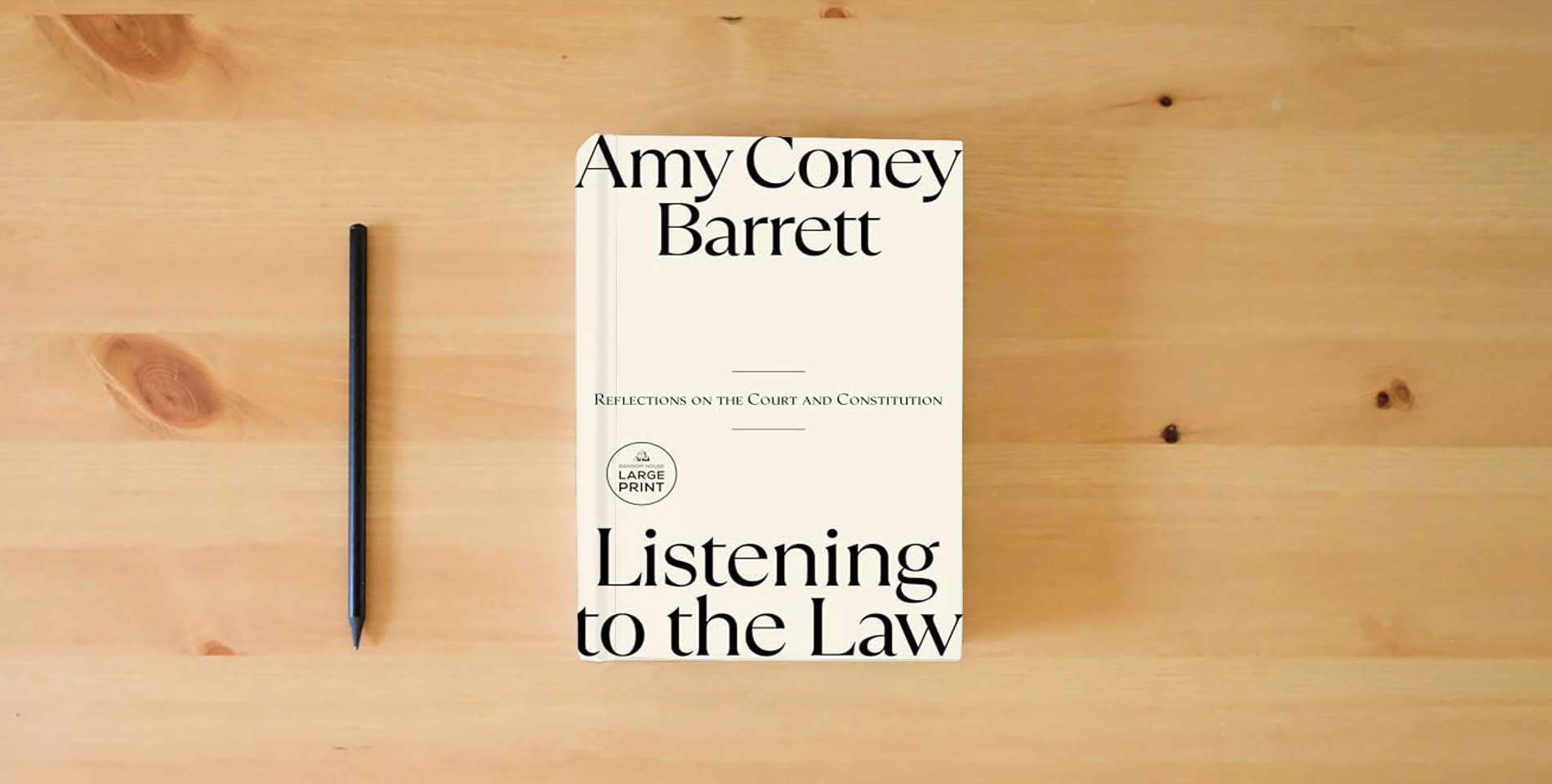 The book Listening to the Law: Reflections on the Court and Constitution is on the table