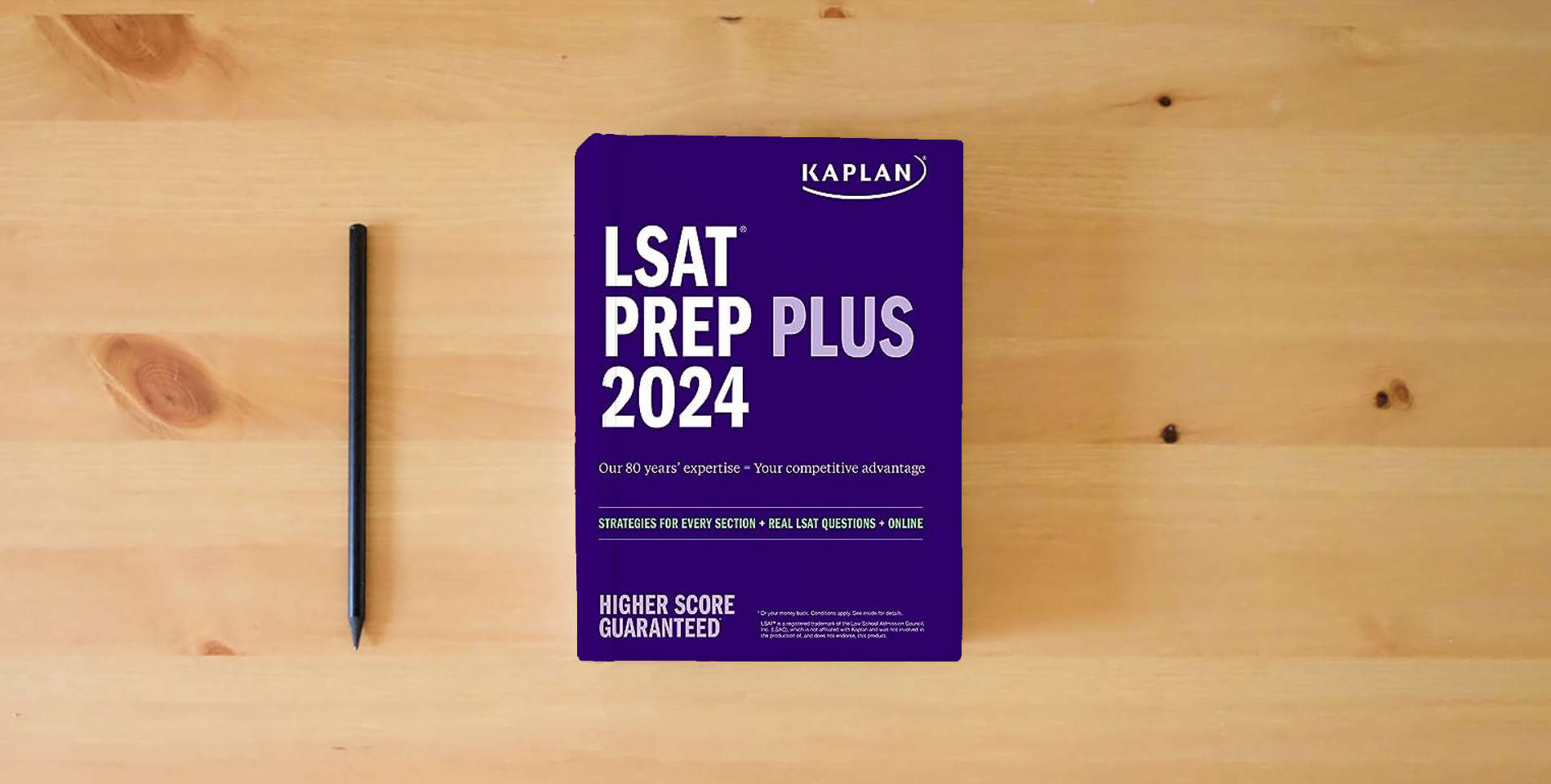 The book LSAT Prep Plus 2024: Strategies for Every Section + Real LSAT Questions + Online (Kaplan Test Prep) is on the table