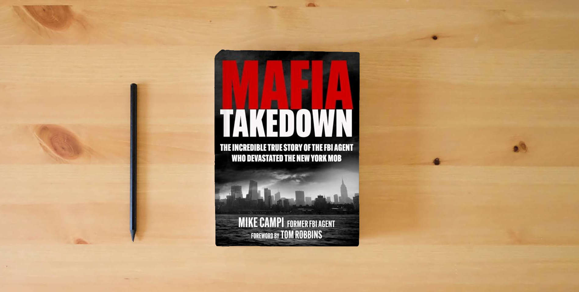The book Mafia Takedown: The Incredible True Story of the FBI Agent Who Devastated the New York Mob is on the table