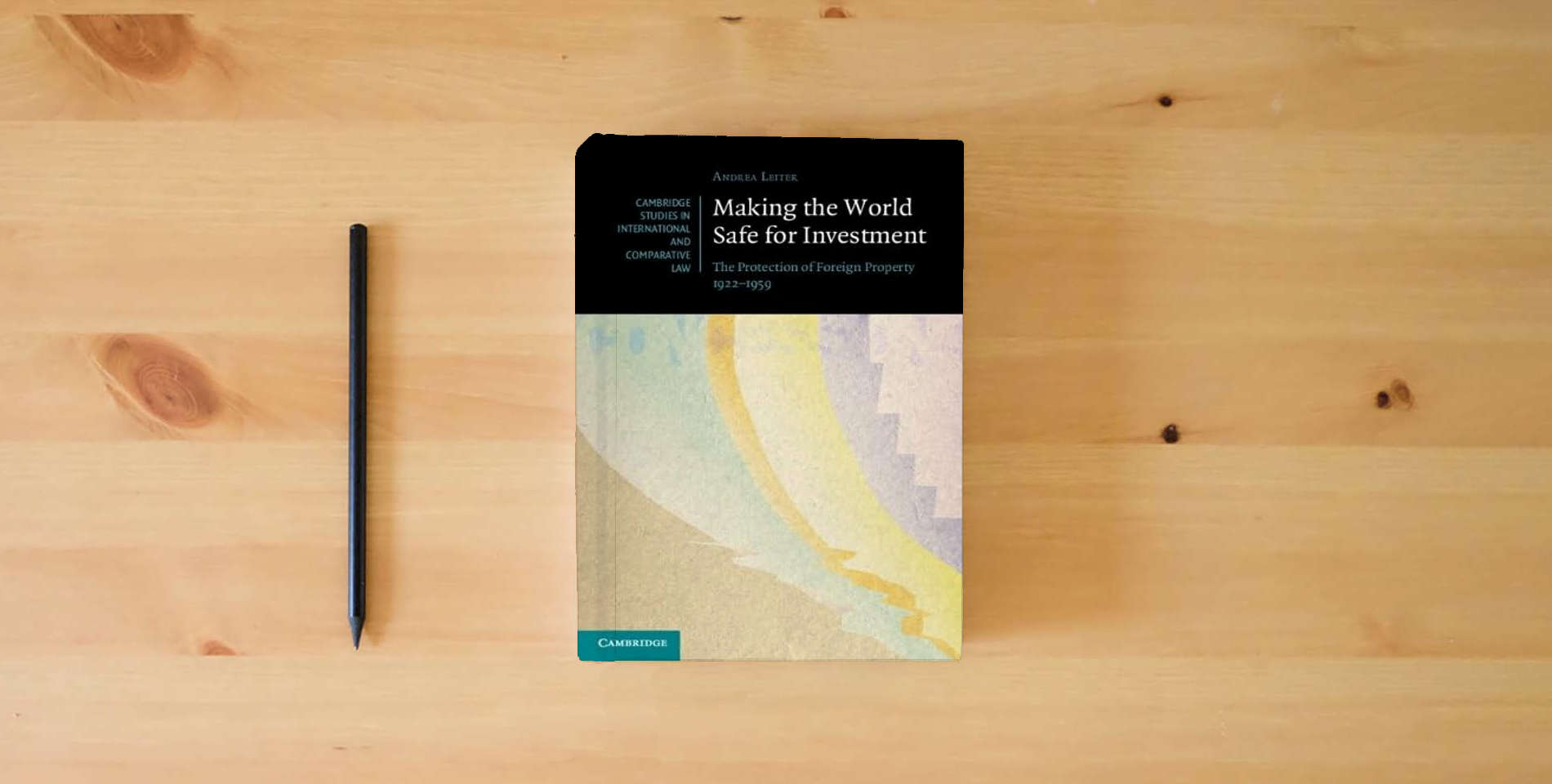 The book Making the World Safe for Investment: The Protection of Foreign Property 1922–1959 (Cambridge Studies in International and Comparative Law, Series Number 178) is on the table