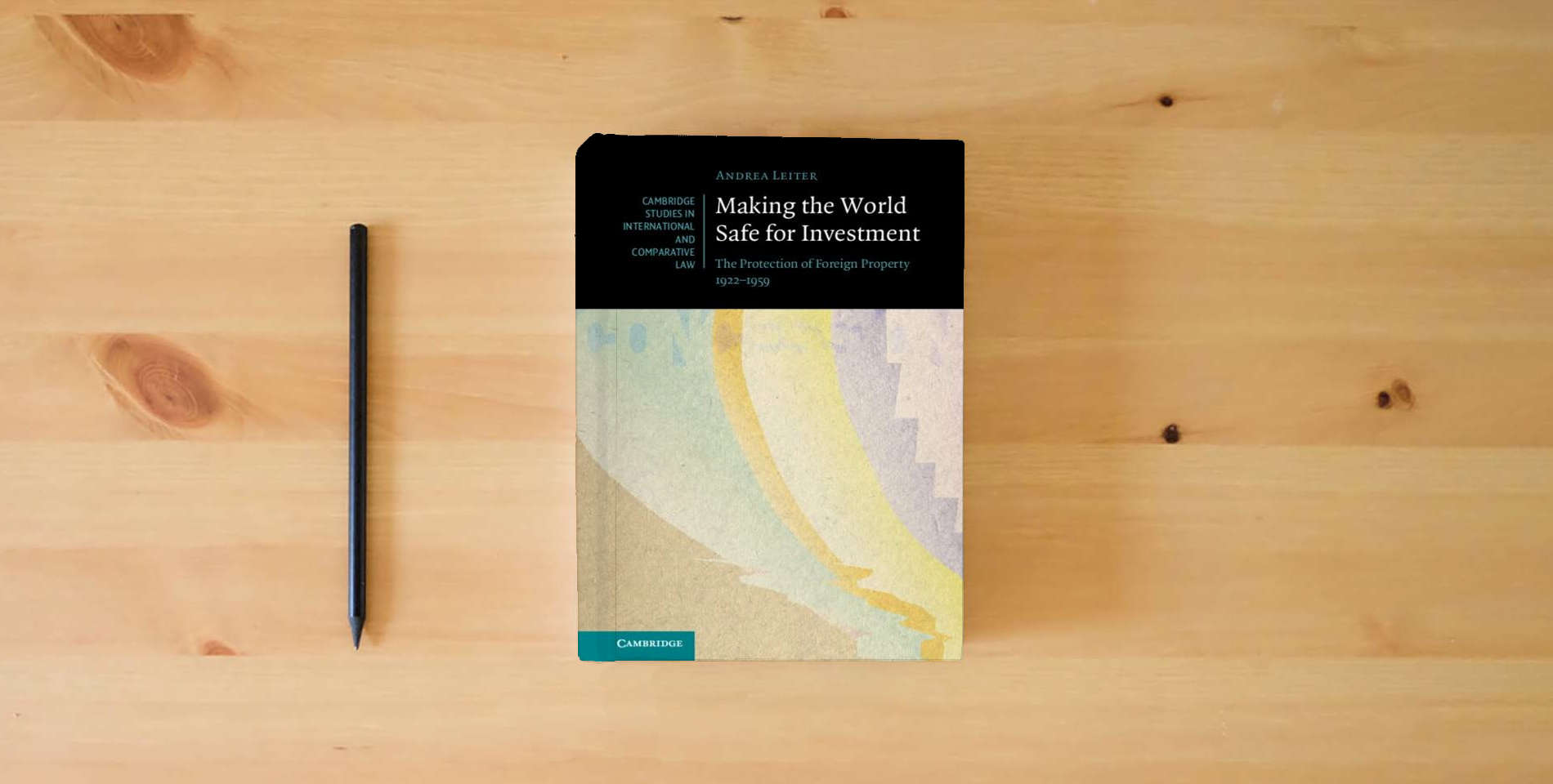 The book Making the World Safe for Investment: The Protection of Foreign Property 1922–1959 (Cambridge Studies in International and Comparative Law, Series Number 178) is on the table