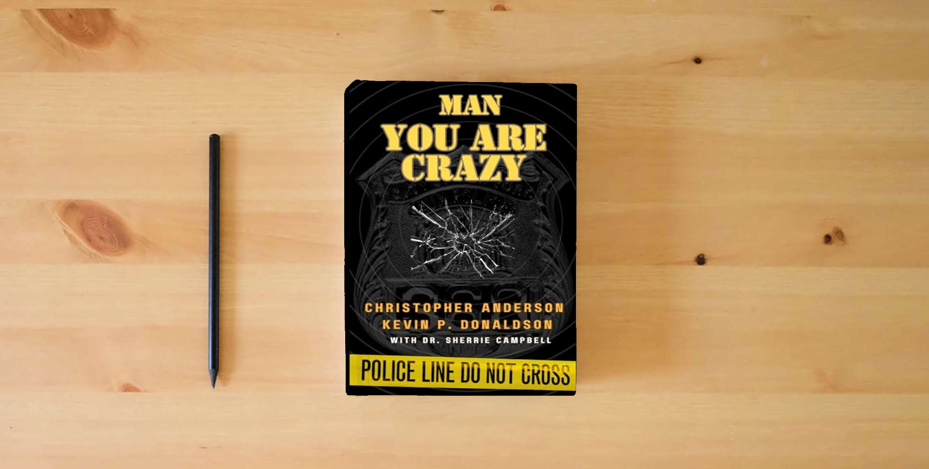 The book Man You Are Crazy: Changing The Face of Mental Health in Law Enforcement is on the table