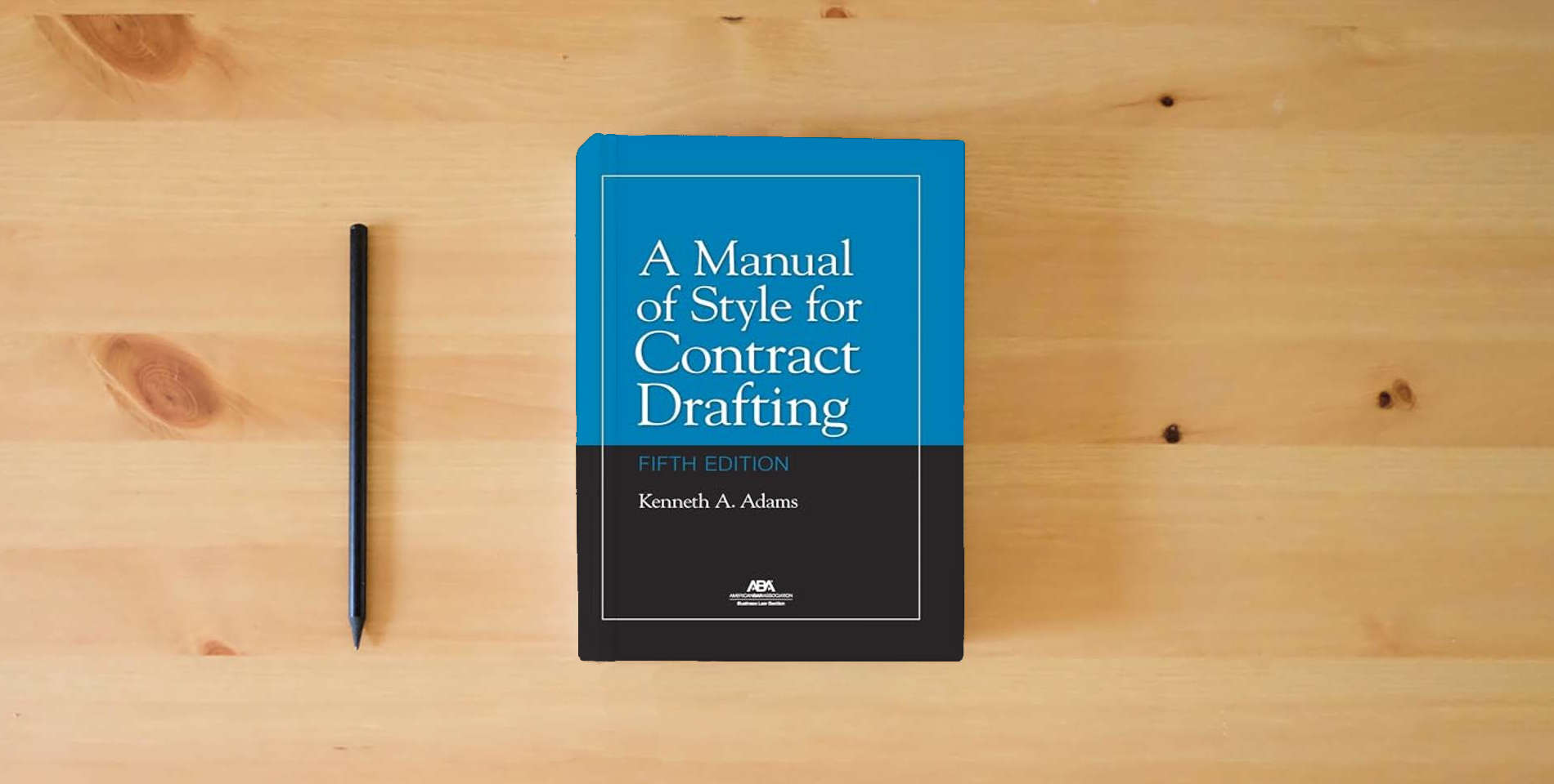The book A Manual of Style for Contract Drafting, Fifth Edition is on the table