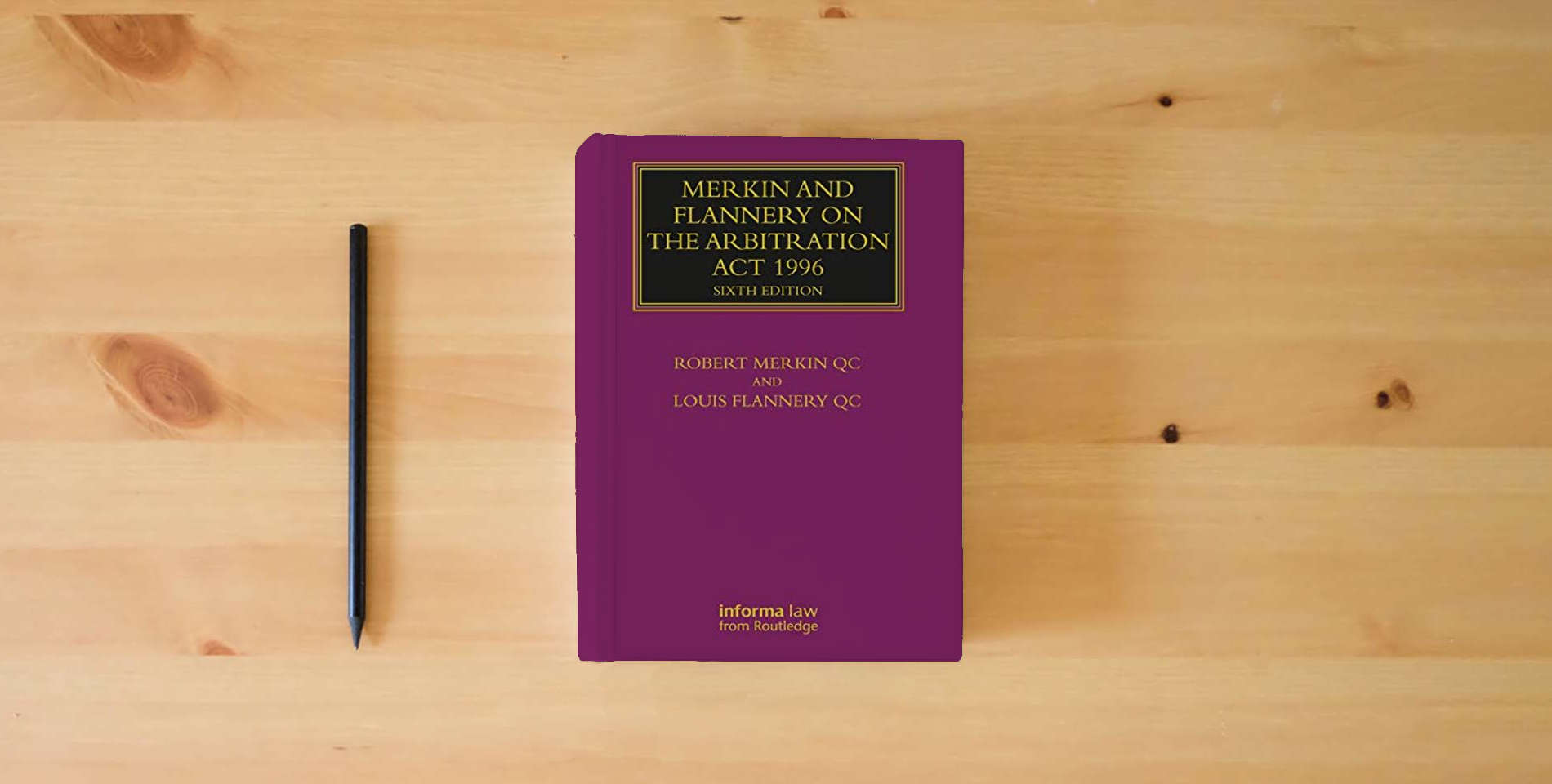 The book Merkin and Flannery on the Arbitration Act 1996 (Lloyd's Arbitration Law Library) is on the table