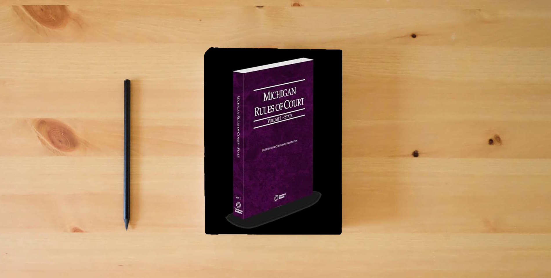 The book Michigan Rules of Court - State, 2025 ed. (Vol. I, Michigan Court Rules) is on the table