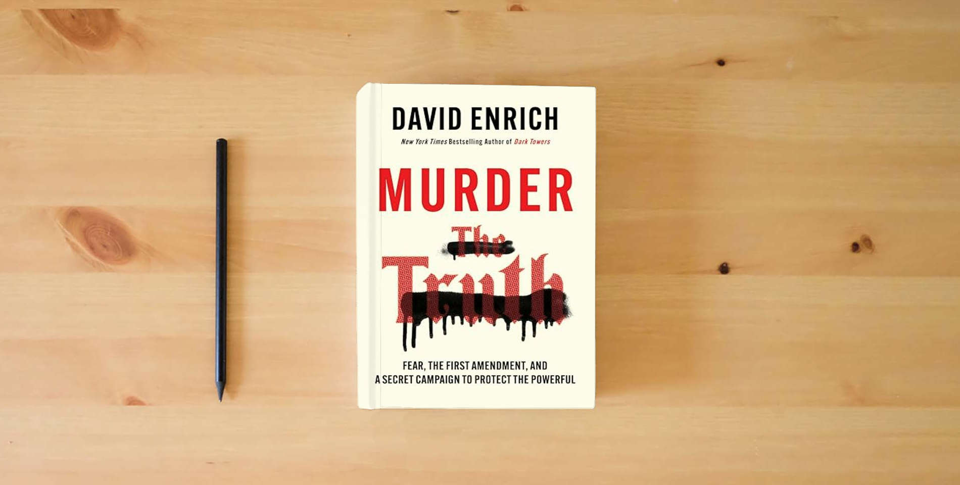 The book Murder the Truth: Fear, the First Amendment, and a Secret Campaign to Protect the Powerful is on the table