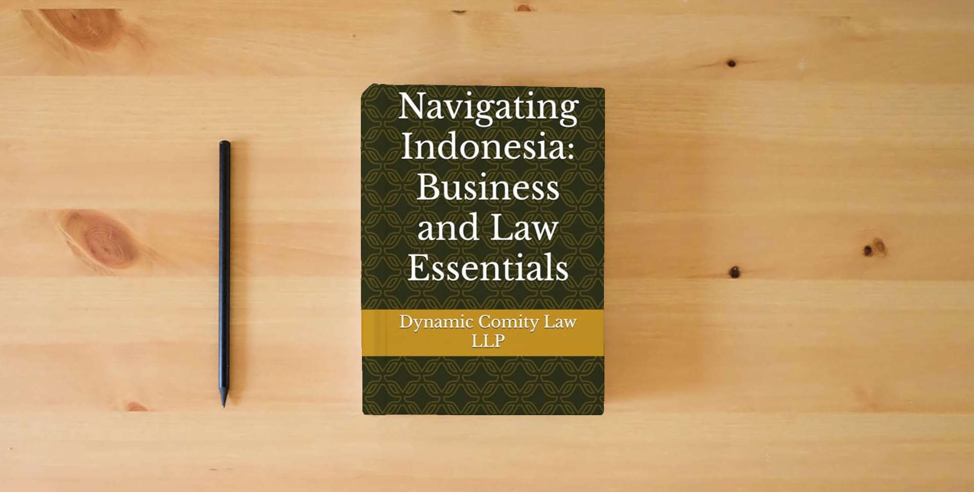 The book Navigating Indonesia: Business and Law Essentials is on the table