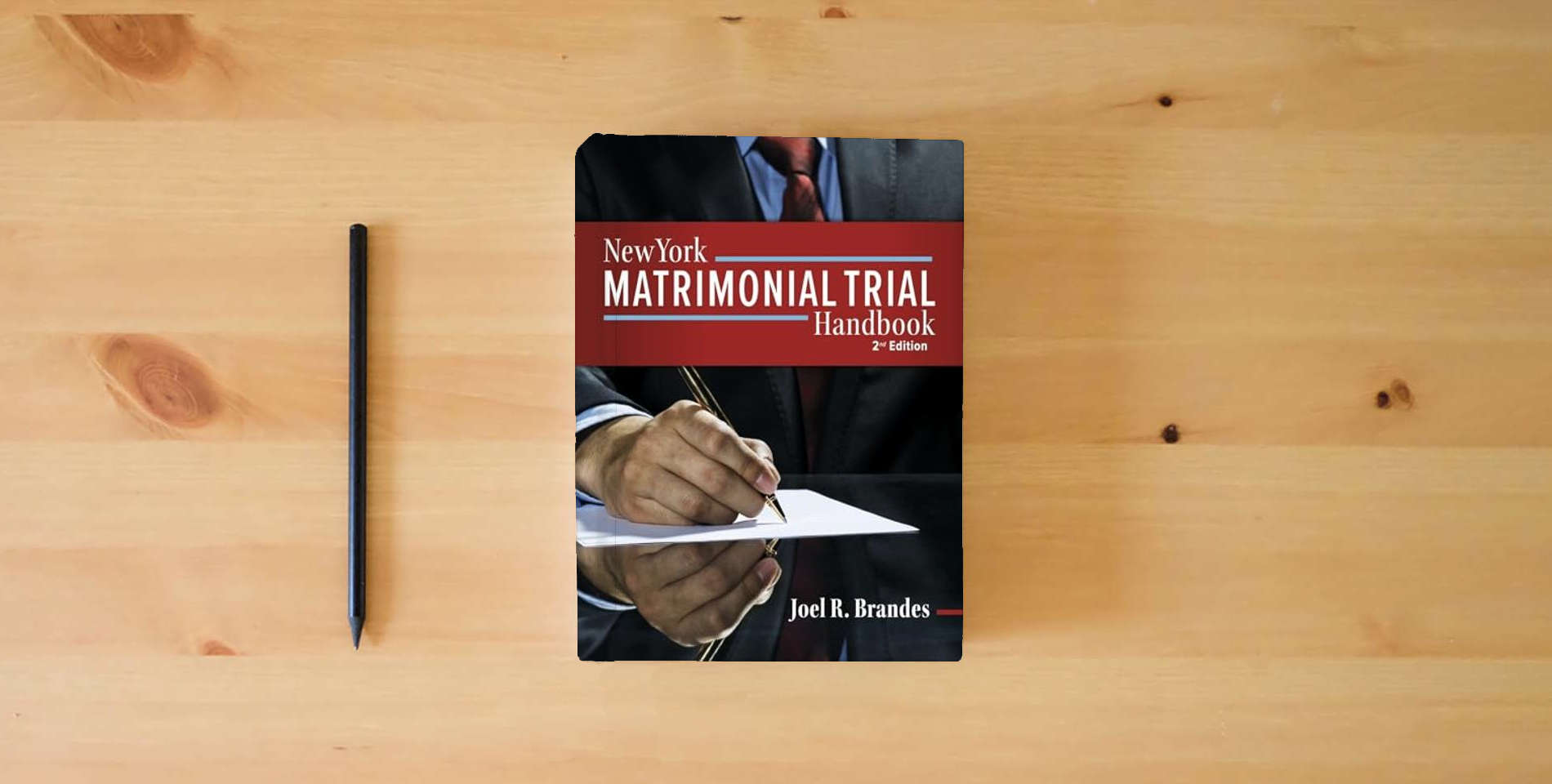 The book New York Matrimonial Trial Handbook 2nd is on the table
