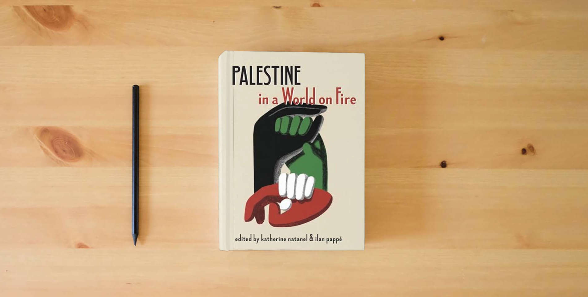 The book Palestine in a World on Fire is on the table