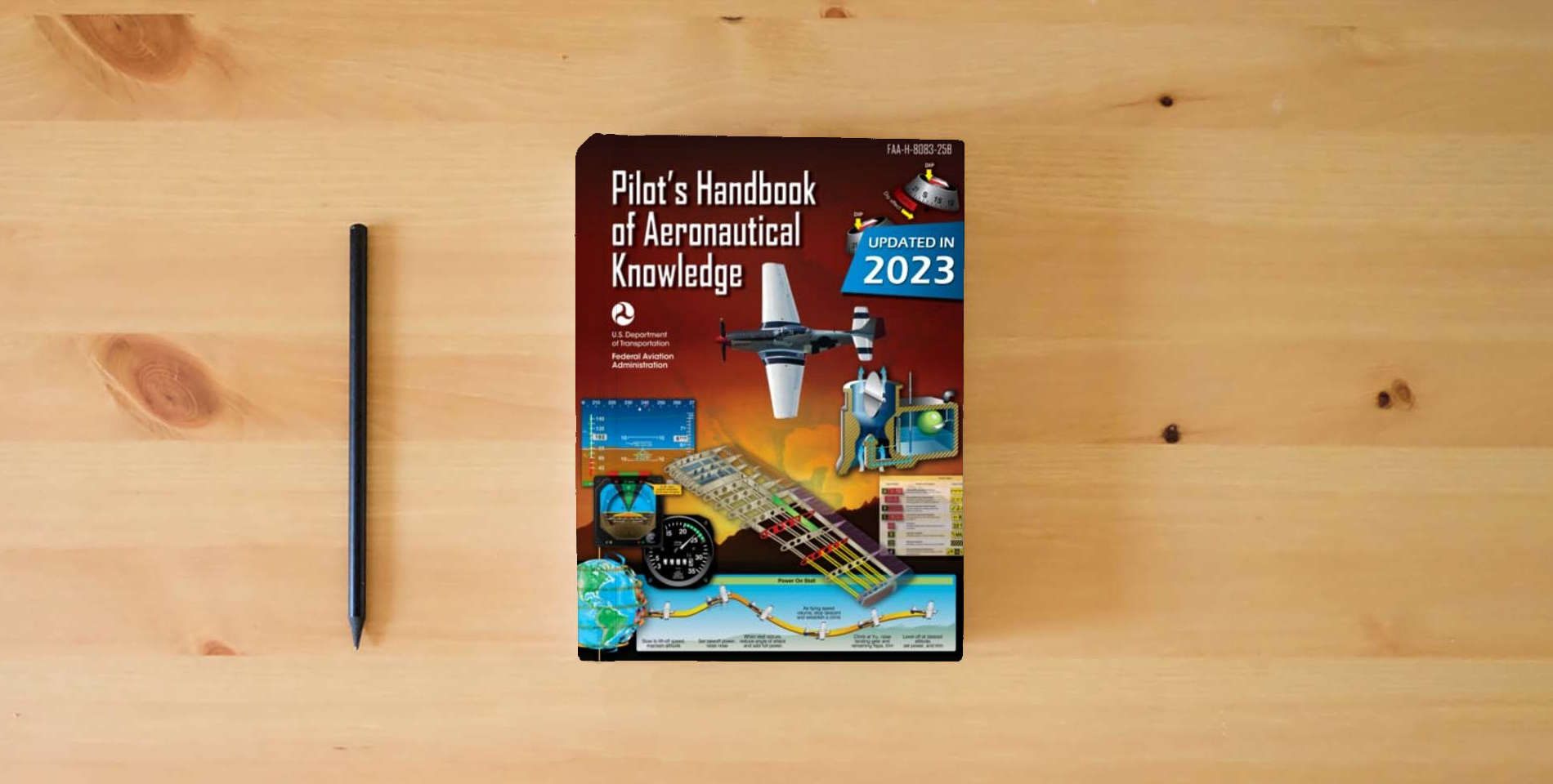 The book Pilot’s Handbook of Aeronautical Knowledge FAA-H-8083-25B (Color Print): Flight Training Study Guide is on the table
