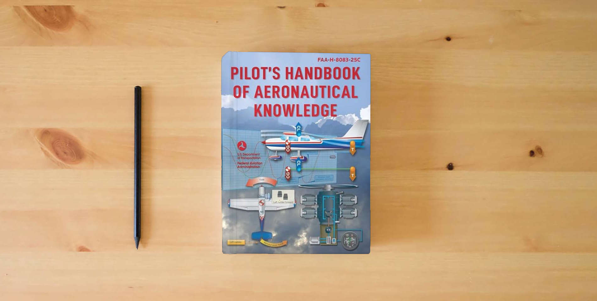 The book Pilot's Handbook of Aeronautical Knowledge: FAA-H-8083-25C is on the table