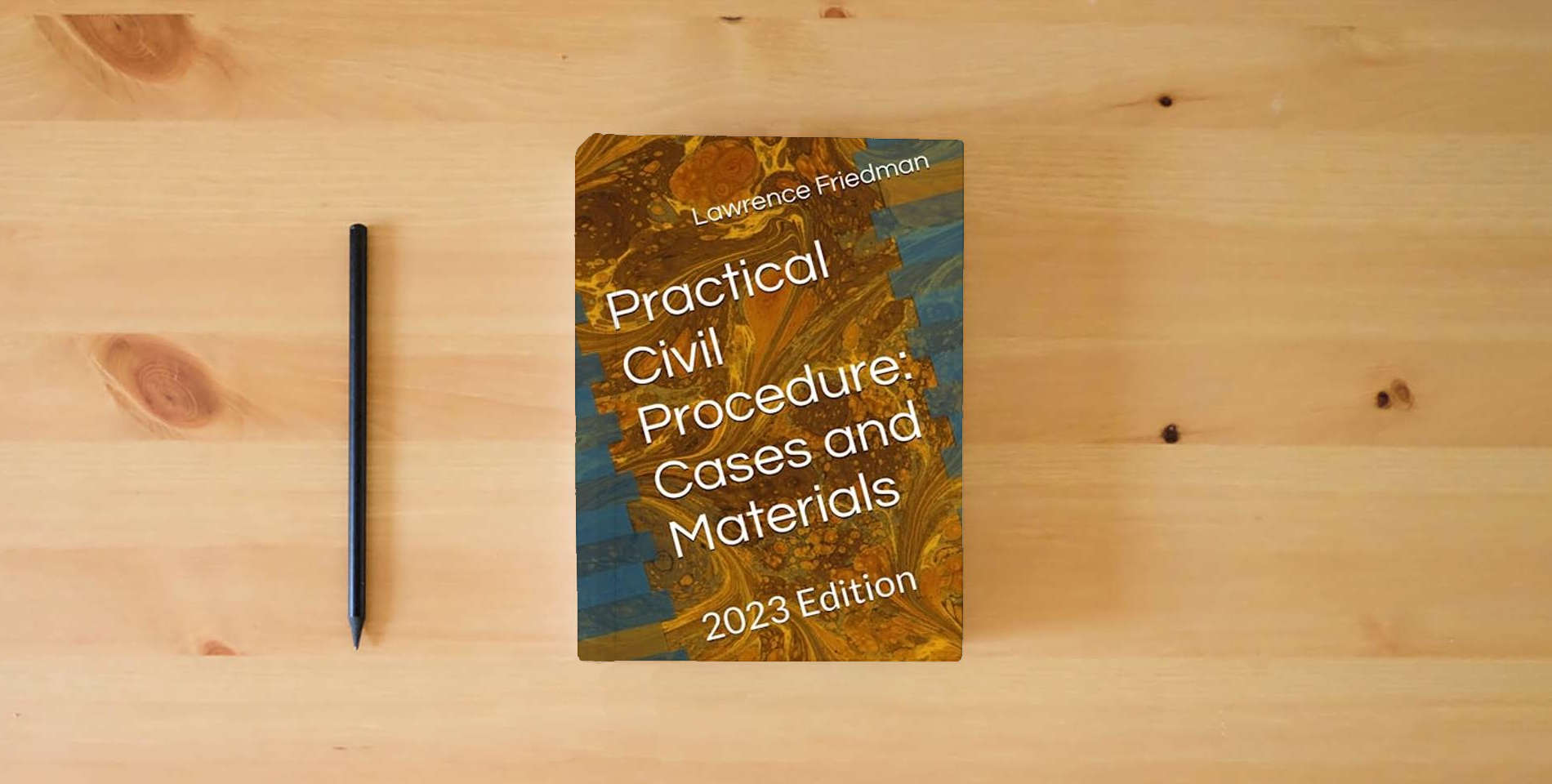 The book Practical Civil Procedure: Cases and Materials: 2023 Edition is on the table