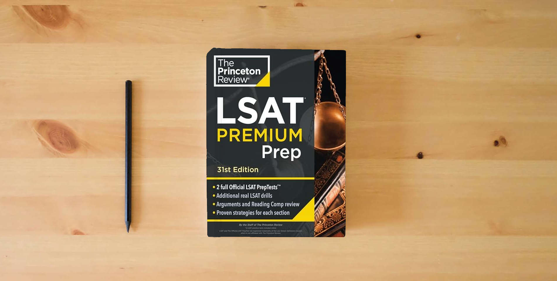 The book Princeton Review LSAT Premium Prep, 31st Edition: 2 Official LSAT PrepTests + Real LSAT Drills + Review for the New Exam (Graduate School Test Preparation) is on the table