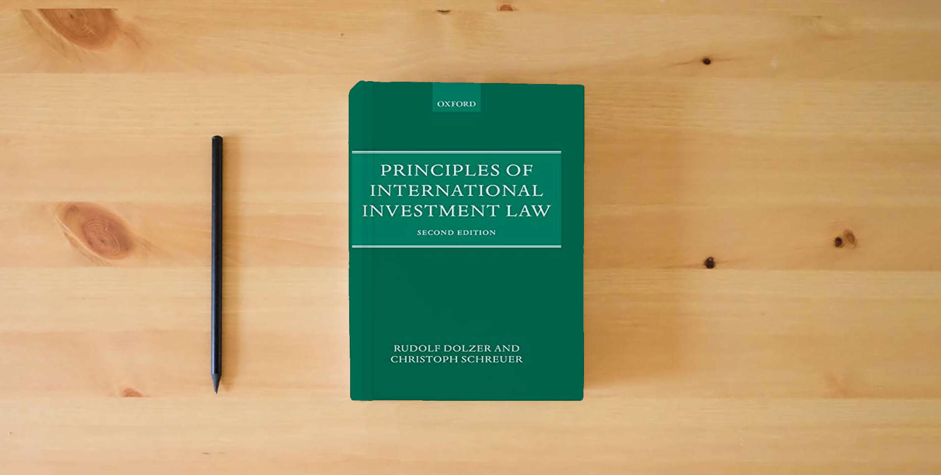The book Principles of International Investment Law is on the table