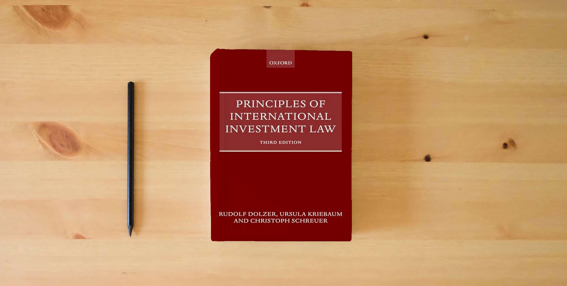 The book Principles of International Investment Law is on the table