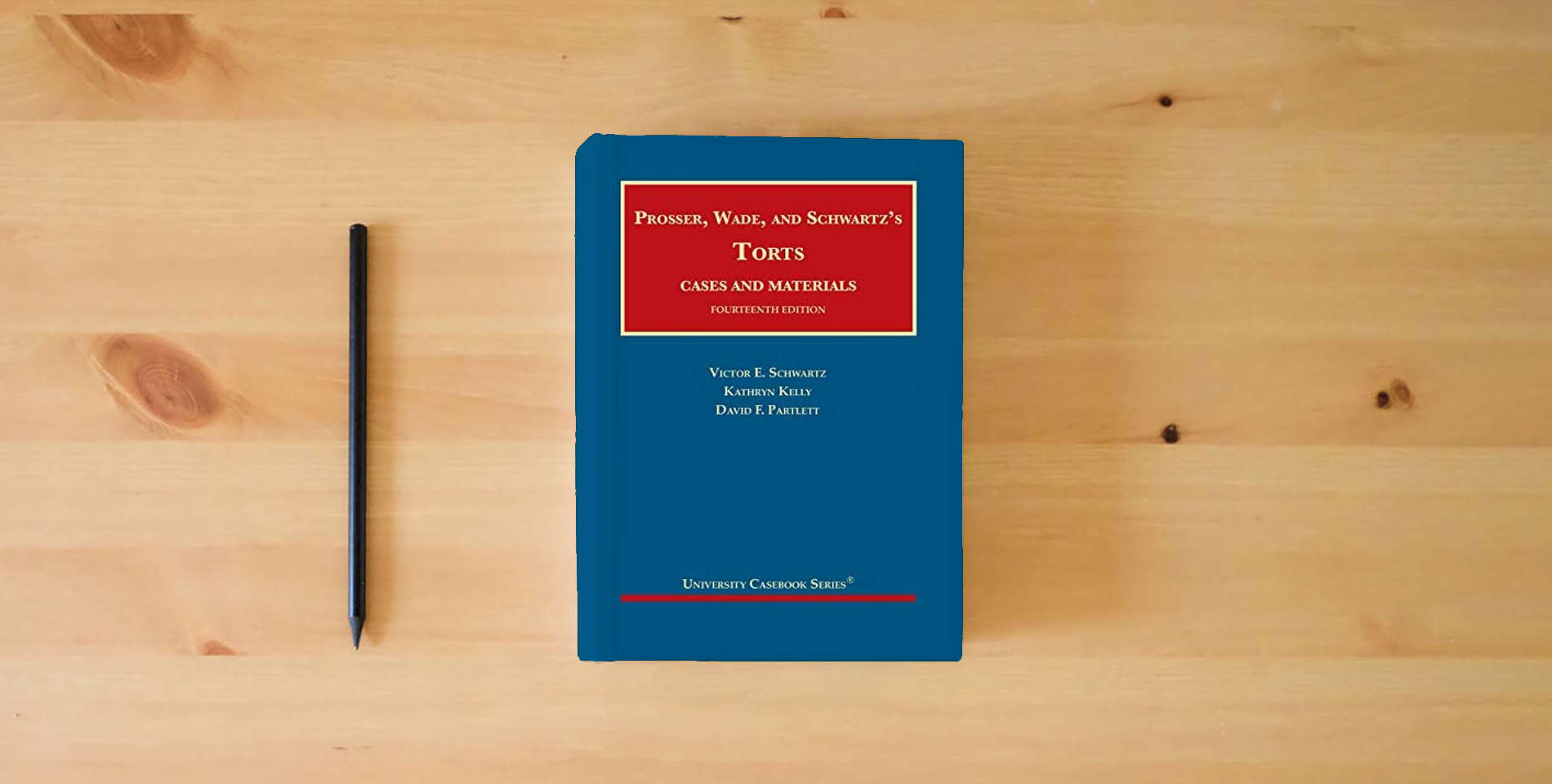The book Prosser, Wade and Schwartz's Torts, Cases and Materials (University Casebook Series) is on the table