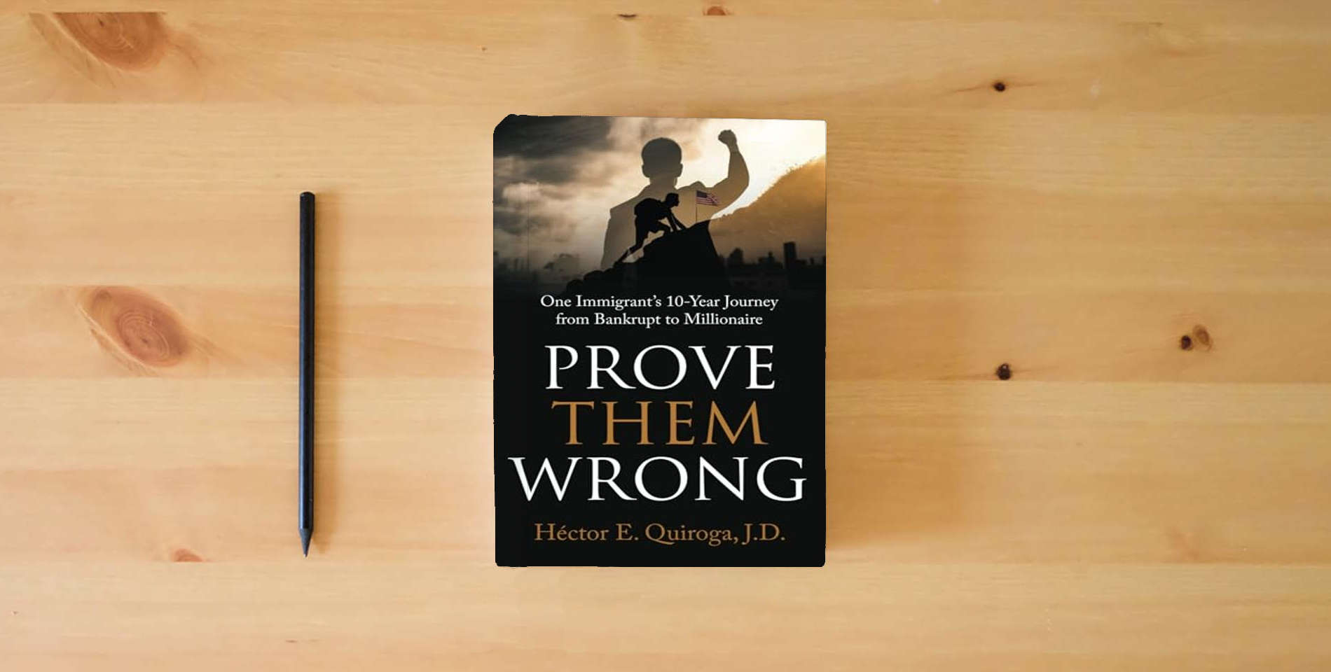 The book Prove Them Wrong: One Immigrant’s 10-Year Journey from Bankrupt to Millionaire is on the table