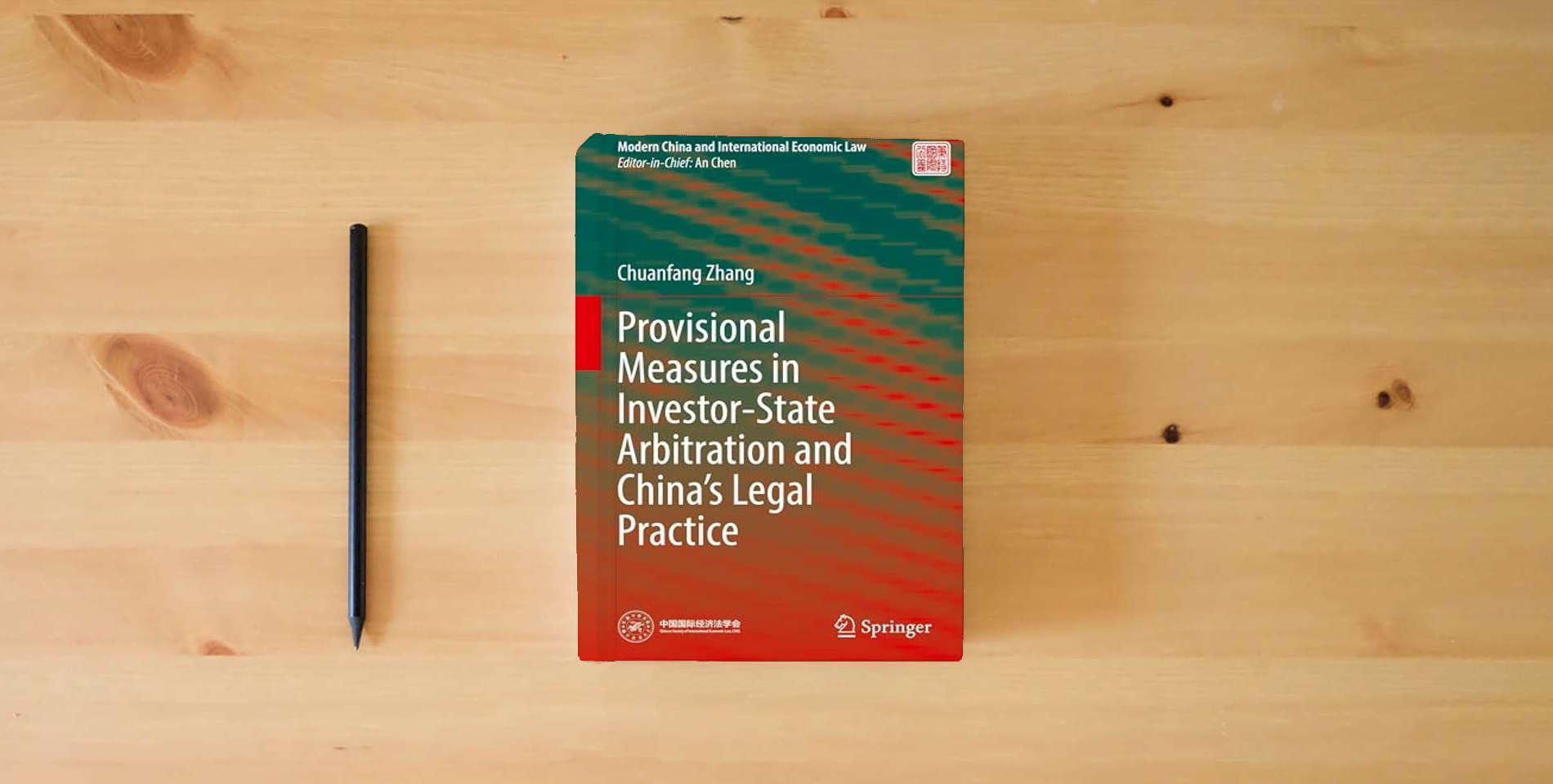 The book Provisional Measures in Investor-State Arbitration and China’s Legal Practice (Modern China and International Economic Law) is on the table