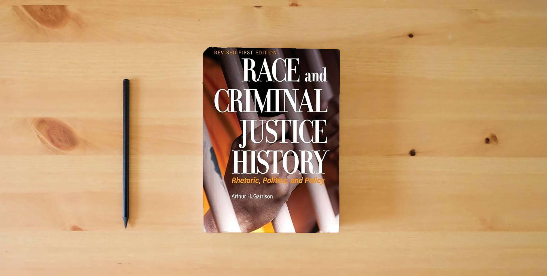 The book Race and Criminal Justice History: Rhetoric, Politics, and Policy is on the table