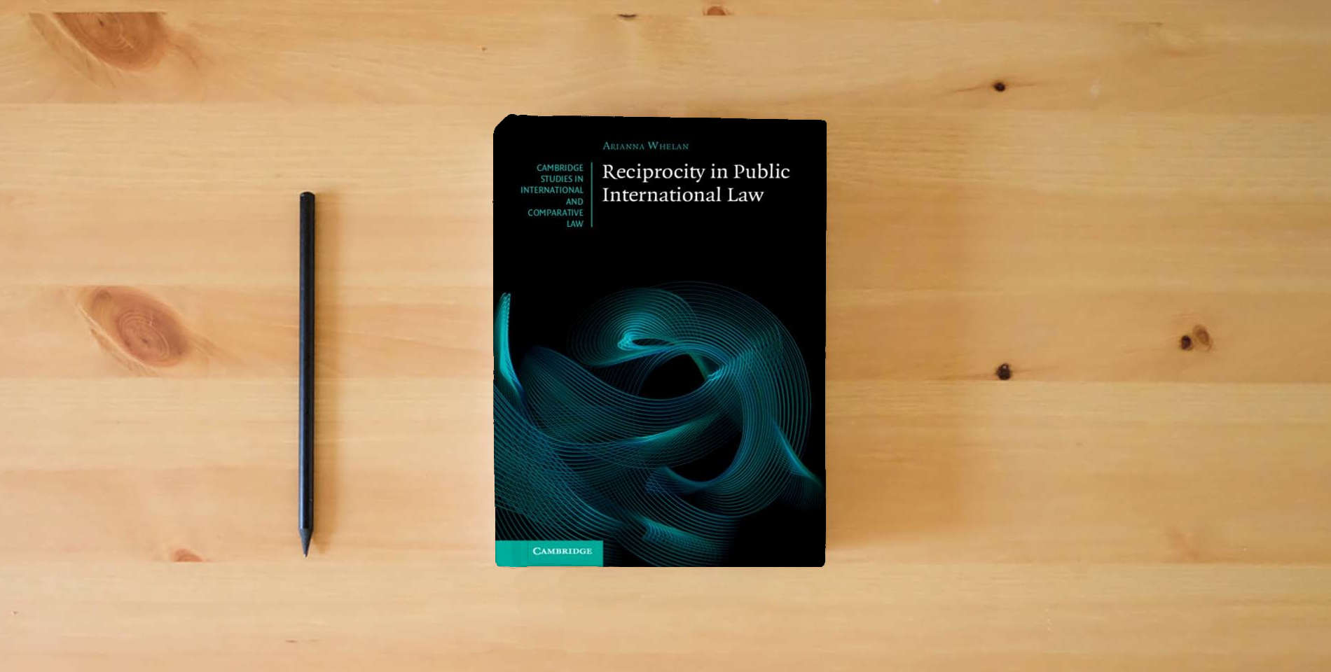 The book Reciprocity in Public International Law (Cambridge Studies in International and Comparative Law) is on the table