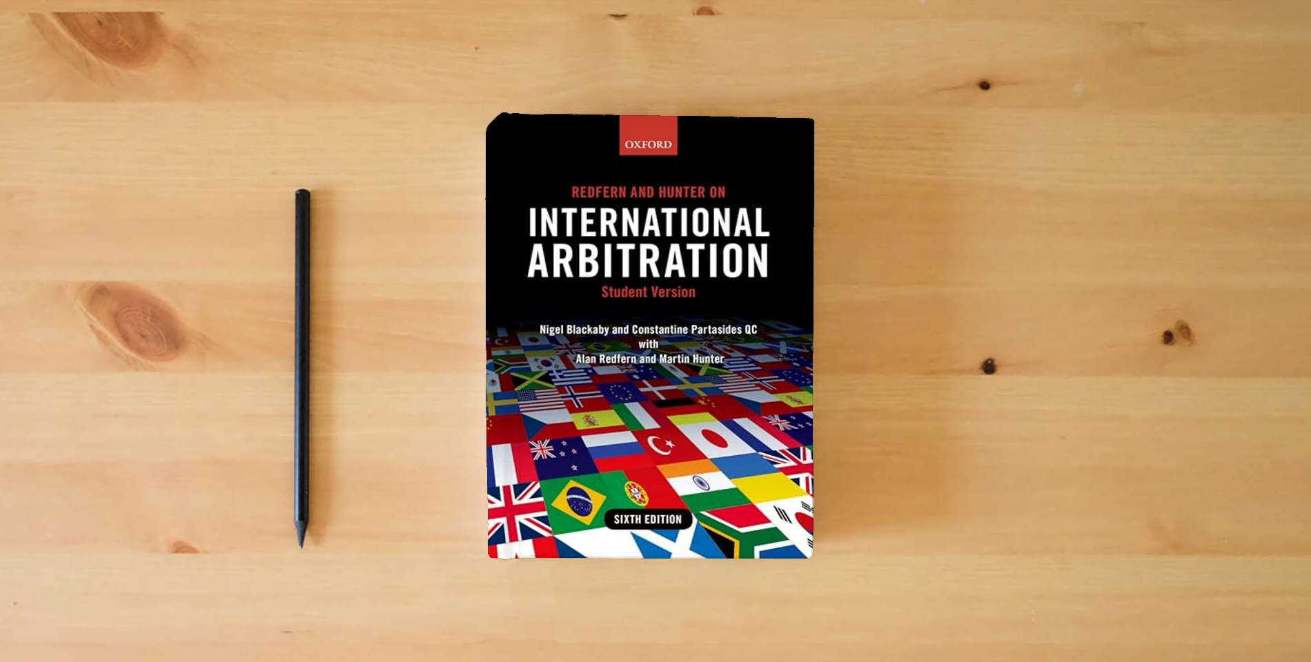 The book Redfern and Hunter on International Arbitration is on the table